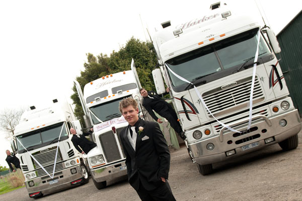 Wedding Trucks at Warrook Cattle Farm form a backdrop for this groom waitig to get married.